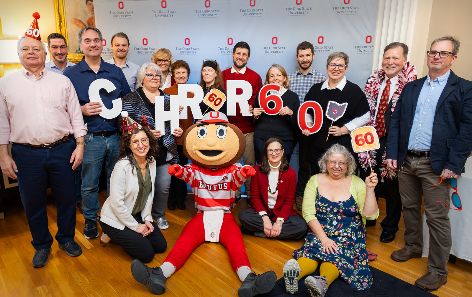 CHRR staff recently posed together at a celebration event to honor the center's 60th anniversary