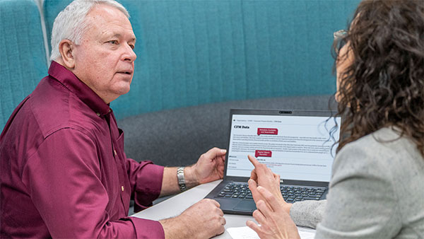 CHRR staffer interacting with a client, discussing secure research tools
