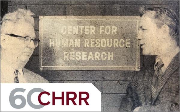 Historical newspaper clipping depicting two men talking in front of CHRR sign