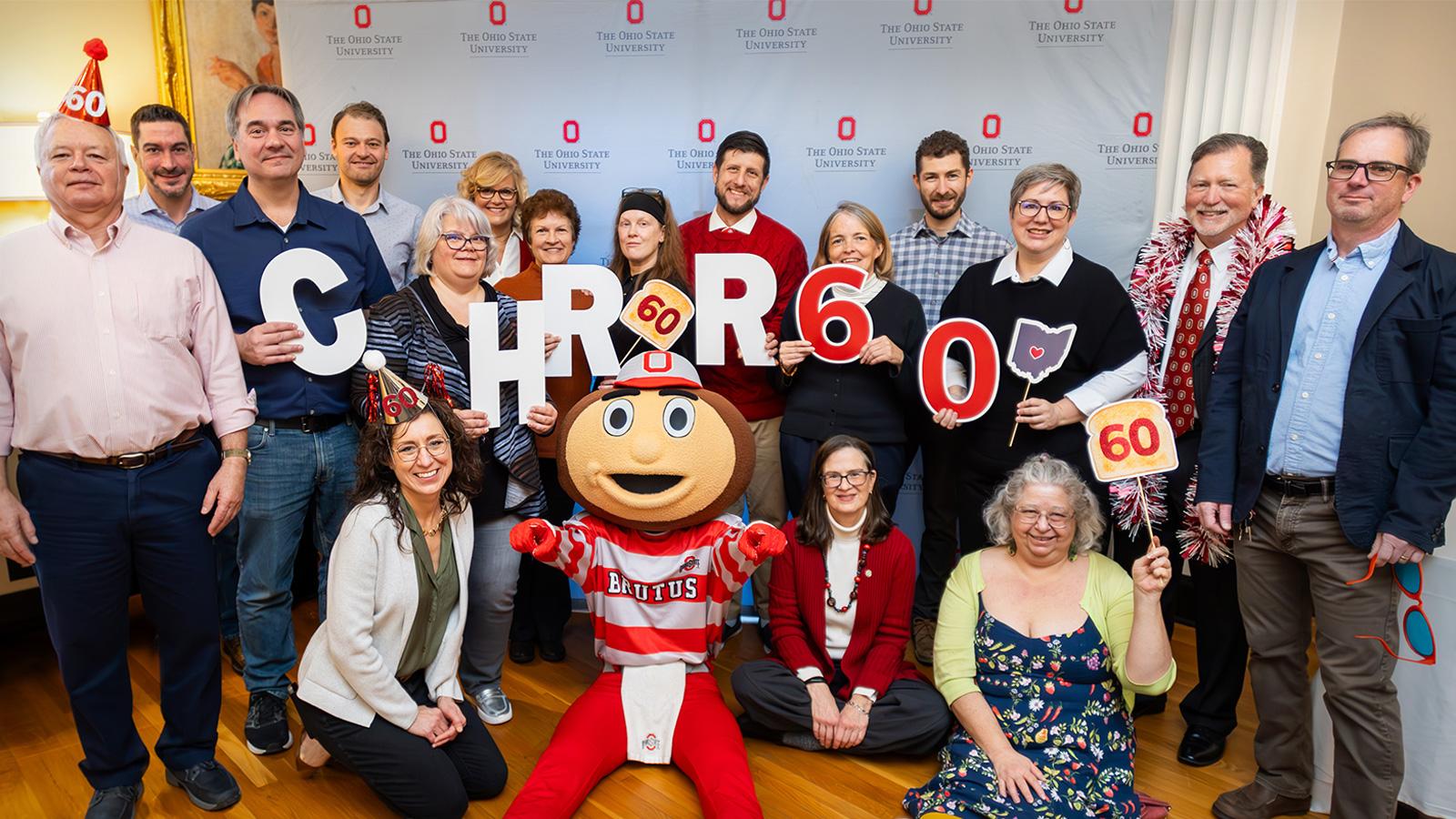 CHRR staff gathered for group photo with Brutus Buckeye at 60th anniversary breakfast party
